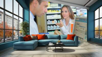 pharmacist and client at pharmacy Wall mural