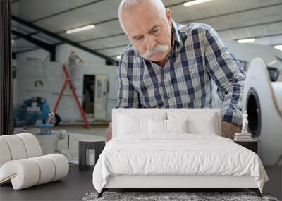 pleasant senior man working with blueprint Wall mural