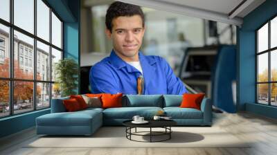 portrait of a male car mechanic standing in the workshop Wall mural