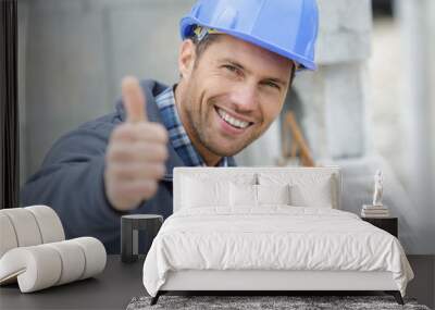 portrait of smiling architect in hardhat sowing thumbs up Wall mural