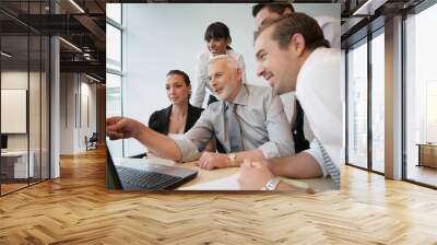 salesteam in front of computer Wall mural