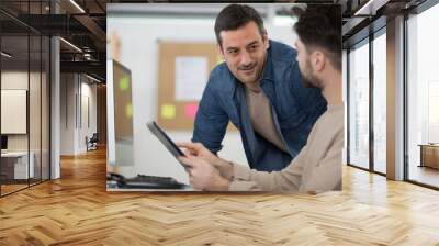 teacher with student in computing class Wall mural