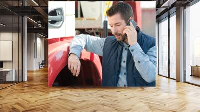 truck driver tending a client on the phone Wall mural