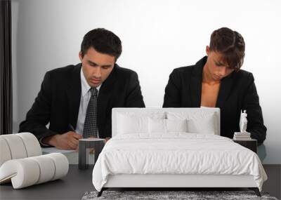 two business people writing at a desk Wall mural