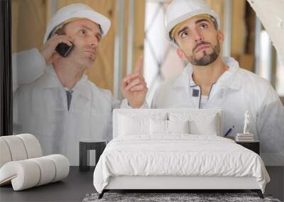 two engineers working in a construction site Wall mural