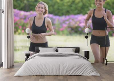 two ladies jogging in park Wall mural