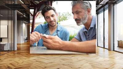 two men sitting at cafe Wall mural