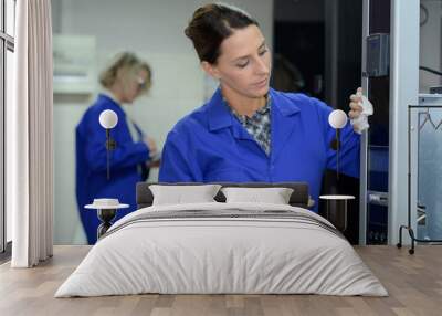 two woman cleaner in uniform cleaning business building Wall mural