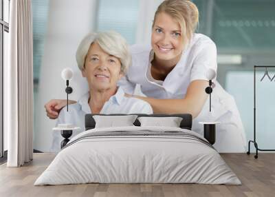 two women embracing each in hospital Wall mural