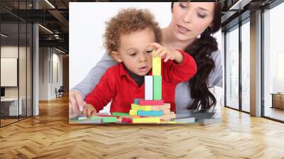 woman and child playing with building blocks Wall mural