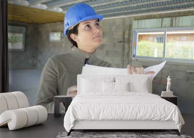 woman engineer working in side building ceiling Wall mural