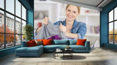 woman or housewife sorting laundry at home Wall mural