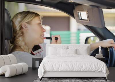 young businesswoman refreshing her make up in car Wall mural