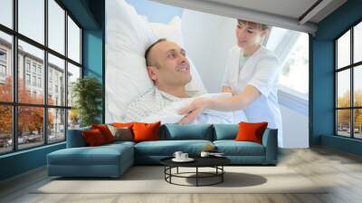 young doctor taking care of patient Wall mural