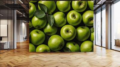 Close up of fresh apple fruit background with leaves, top view. Photorealistic high resolution macro photography for advertising or food design. Wall mural