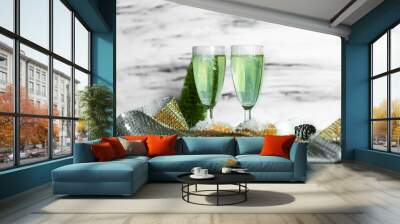 two glasses of green champagne on a table Wall mural