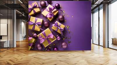 elegant gift boxes in golden with purple ribbons surrounded by matching baubles and glitter on a purple background banner design for winter holidays Wall mural