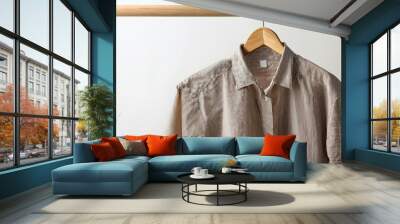 linen shirt hanging on wooden hanger Wall mural