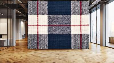 Close-up of a classic plaid textile featuring navy, white, and red patterns, ideal for crafting and design projects. Wall mural