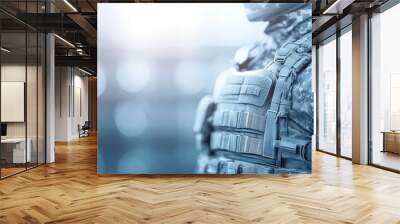 Close-up of a soldier in tactical gear, showcasing camouflage patterns and military equipment, symbolizing strength and readiness. Wall mural