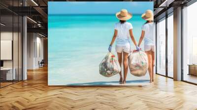 Two women cleaning up trash on a beautiful beach, promoting environmental awareness and ocean conservation. Wall mural