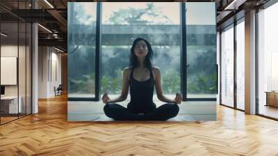 Beautiful Asian woman practicing yoga in a serene, modern living space, with simple background and natural light, dressed in stylish activewear, emphasizing the wellness and peace Wall mural