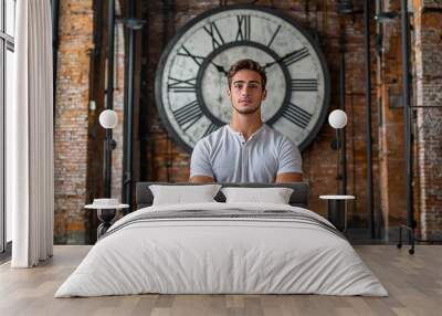 Individual in Casual Attire Posing with Vintage Clock Wall mural