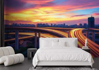 Long exposure of a highway overpass at dusk, with light trails from vehicles below and a colorful sky above, creating a dynamic and beautiful image  Wall mural