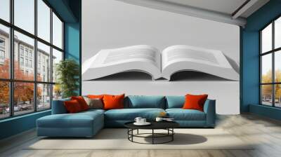 A book is open to a page with a white background Wall mural