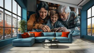 A family of three, a woman, a man and a child, are playing a board game together Wall mural