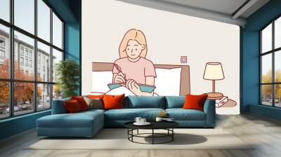  woman sitting on bed and writing a diary. Hand drawn style vector design illustrations. Wall mural