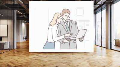 Business colleagues looking at tablet in office. Hand drawn style vector design illustrations. Wall mural