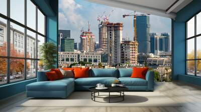 Tel Aviv's skyline high rise construction with cranes and water heaters, Israel. A tall building in a city. High quality photo Wall mural