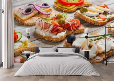 Sandwiches on wooden background, closeup Wall mural