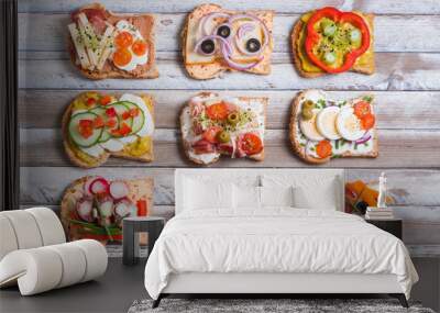 Sandwiches on wooden background, top view Wall mural