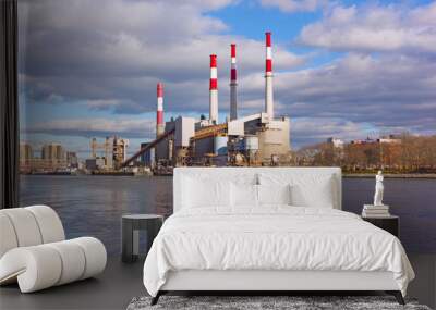 Urban landscape with electric power station on a riverbank. City skyline in early morning in winter. Wall mural