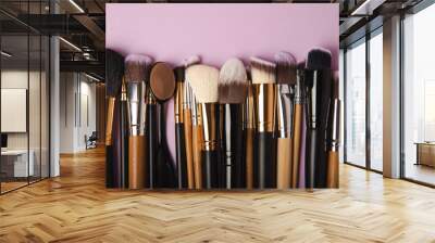 Cosmetic brush for make-up on a lilac background. Cosmetic product for make-up. Creative and beauty fashion concept. Fashion. Collection of cosmetic makeup brushes, top view, banner.Place for text.  Wall mural