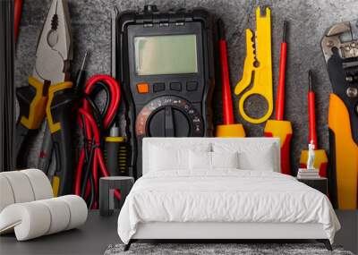 Electrician equipment on marble background with copy space.Top view.Electrician tool set.Multimeter, tester,screwdrivers,cutters,duct tape,lamps,tape measure and wires.Flet lay. Wall mural