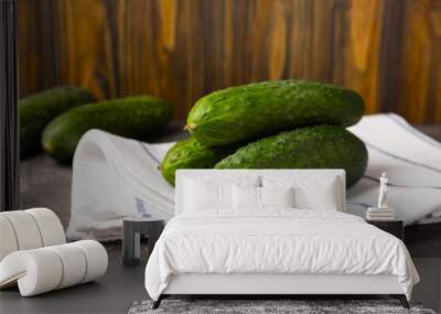 Fresh cucumbers on a white black texture background. Vegetarian organic vegetables.Ingredient for salad. Healthy food.Copy space.Place for text Wall mural