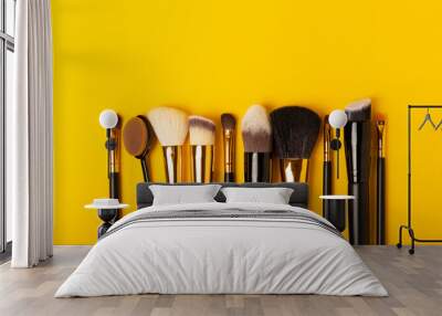 set of cosmetic brushes on a yellow background. makeup brushes. makeup tool. beauty concept.professi Wall mural