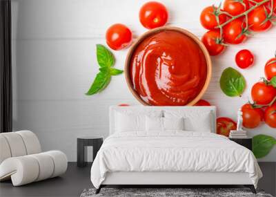 Tomato paste, sauce, ketchup in a bowl and cherry tomatoes with fresh basil leaves on a textured wooden background. Vitamins and detox diet. Vegetable and vegetarian food. Space for text. Copy space. Wall mural