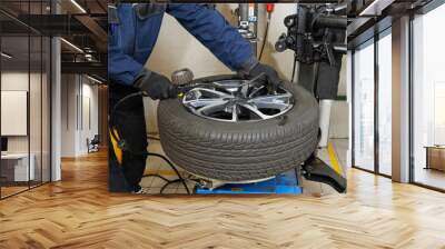 Car maintenance and service center. Vehicle tire repair and replacement equipment. Seasonal tire change Wall mural