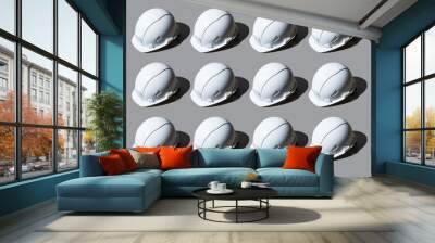 Colourful pattern of white helmets on grey background. View from top. Wall mural