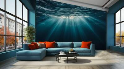 An amazing marine life photo with rays of sunlight piercing through the deep blue ocean Wall mural