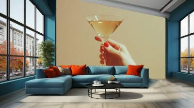 An isolated vintage retro female hand holding a cocktail on a plain background is typical of the 1960s and 1970s Wall mural