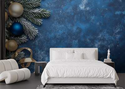 Blue and gold ornaments on a dark blue snowy background decorate the Christmas tree Wall mural