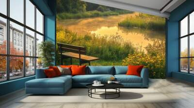 Early morning view at a riverside park with flowers and greenery surrounding a wooden bench Wall mural