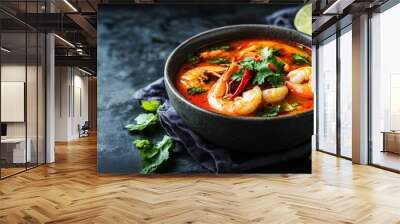 Fresh shrimp and vegetables in spicy Thai soup. Wall mural