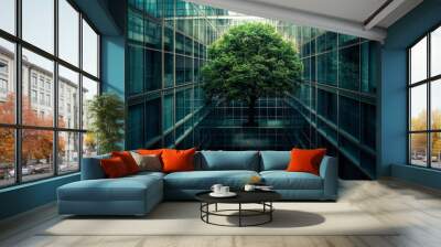 From the outside, a lush green tree is enclosed within a modern glass building. The modern architecture contrasts with the tree's natural texture. Wall mural