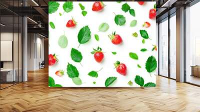 Half strawberry slices falling or floating in the air with green leaves isolated on white. Fresh organic fruit with high vitamin and mineral content. Wall mural